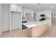 Modern kitchen with white cabinets, quartz countertops, and an island at 2116 Fuller Rd, Las Vegas, NV 89108