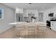 Modern kitchen with white cabinets, island, and stainless steel appliances at 2116 Fuller Rd, Las Vegas, NV 89108