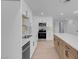 Modern kitchen featuring white cabinets, stainless steel appliances, and an island at 2116 Fuller Rd, Las Vegas, NV 89108