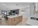 Open concept kitchen with island and breakfast bar at 2116 Fuller Rd, Las Vegas, NV 89108