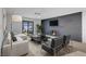 Living room with gray brick fireplace and access to backyard at 2116 Fuller Rd, Las Vegas, NV 89108