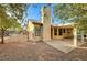 Backyard view showing home's exterior, patio, and landscaping at 2144 Buckeye Reef St, Henderson, NV 89002