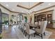 Elegant dining room with a large table and chandelier at 22 Rue Grimaldi Way, Henderson, NV 89011