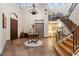 Elegant two-story entryway with tile floors, a grand staircase, and a chandelier at 22 Rue Grimaldi Way, Henderson, NV 89011