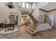 Grand entryway with curved staircase and chandelier at 22 Rue Grimaldi Way, Henderson, NV 89011