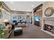Spacious Gathering room with a fireplace, built-in cabinetry, and a large sectional sofa at 22 Rue Grimaldi Way, Henderson, NV 89011