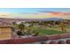 Lake and golf course view from home's balcony at sunset at 22 Rue Grimaldi Way, Henderson, NV 89011