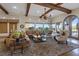 Open living area with hardwood floors, large windows, and ample natural light at 22 Rue Grimaldi Way, Henderson, NV 89011