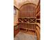 A custom wine cellar with wooden racks, tiled floors and walls, and climate control at 22 Rue Grimaldi Way, Henderson, NV 89011