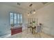 Bright dining area with glass table and four chairs at 2871 S Woodchips Rd, Pahrump, NV 89048