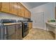 Convenient laundry room with washer, dryer, and ample cabinetry at 2871 S Woodchips Rd, Pahrump, NV 89048