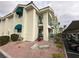 Exterior view of condo building with parking and landscaping at 3550 Bay Sands Dr # 1017, Laughlin, NV 89029