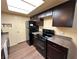Modern kitchen with dark cabinets, granite counters, and stainless steel appliances at 3550 Bay Sands Dr # 1017, Laughlin, NV 89029