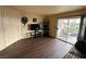 Living room featuring dark laminate floors and access to patio at 3550 Bay Sands Dr # 1017, Laughlin, NV 89029