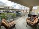 Private patio with wicker furniture and views of parking at 3550 Bay Sands Dr # 1017, Laughlin, NV 89029