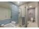 Modern bathroom with glass shower and blue tile at 3726 Las Vegas Blvd # 705, Las Vegas, NV 89158