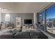 Living room with sectional sofa and breathtaking city views at 3726 Las Vegas Blvd # 705, Las Vegas, NV 89158
