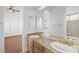 Bathroom with double sinks, granite countertop and large mirror at 3757 Brittany Nicole Ct, Las Vegas, NV 89139