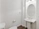 Elegant bathroom featuring a pedestal sink and large mirror at 3757 Brittany Nicole Ct, Las Vegas, NV 89139