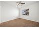 Well-lit bedroom with ceiling fan and carpeted floor at 3757 Brittany Nicole Ct, Las Vegas, NV 89139