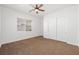 Well-lit bedroom with ceiling fan and large closet at 3757 Brittany Nicole Ct, Las Vegas, NV 89139
