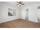 Bright bedroom with ceiling fan,window, and carpet flooring at 3757 Brittany Nicole Ct, Las Vegas, NV 89139