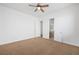 Spacious bedroom with ceiling fan and bathroom access at 3757 Brittany Nicole Ct, Las Vegas, NV 89139