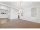 Bright dining room with carpet flooring and elegant chandelier at 3757 Brittany Nicole Ct, Las Vegas, NV 89139