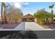 Single-story home with a large driveway and mature landscaping at 3757 Brittany Nicole Ct, Las Vegas, NV 89139