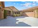 Tan colored house with attached garage and gated entry at 3757 Brittany Nicole Ct, Las Vegas, NV 89139