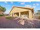 Tan house exterior with covered patio and yard at 3757 Brittany Nicole Ct, Las Vegas, NV 89139