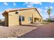 Tan house exterior with covered patio and yard at 3757 Brittany Nicole Ct, Las Vegas, NV 89139