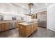 Gourmet kitchen with island, stainless steel appliances, and wine rack at 3757 Brittany Nicole Ct, Las Vegas, NV 89139