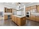 Spacious kitchen with island, stainless steel appliances, and wood cabinets at 3757 Brittany Nicole Ct, Las Vegas, NV 89139