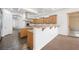 Kitchen with island, wood cabinets, and stainless steel appliances at 3757 Brittany Nicole Ct, Las Vegas, NV 89139