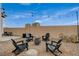 Backyard fire pit with seating for four at 376 Hanbury Manor Ln, Las Vegas, NV 89145