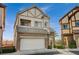 Two-story house with stone and stucco exterior, two-car garage at 376 Hanbury Manor Ln, Las Vegas, NV 89145