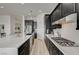 Modern kitchen with stainless steel appliances and white quartz countertops at 376 Hanbury Manor Ln, Las Vegas, NV 89145