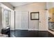 Bedroom with large closet, dark wood floors, and a window at 4002 Extenso Dr, North Las Vegas, NV 89032