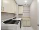 Laundry room with washer, dryer, and additional cabinets at 4255 Veraz St, Las Vegas, NV 89135