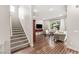 Elegant staircase with carpeted steps and hardwood flooring on the landing at 4255 Veraz St, Las Vegas, NV 89135