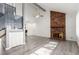 Living room featuring a brick fireplace and gray flooring at 4414 E Flamingo Rd, Las Vegas, NV 89121