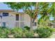 Tan two-story building with landscaping and walkway at 4770 Topaz St # 77, Las Vegas, NV 89121