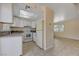 White kitchen with granite countertops and appliances at 4770 Topaz St # 77, Las Vegas, NV 89121