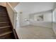 Living room with tile floors and staircase at 4770 Topaz St # 77, Las Vegas, NV 89121