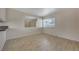 Living room with tile floors and mirrored wall at 4770 Topaz St # 77, Las Vegas, NV 89121