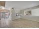 Bright living room with tile floors and kitchen view at 4770 Topaz St # 77, Las Vegas, NV 89121