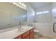 Bathroom with walk-in tub, single sink vanity, and toilet at 4880 Da Vinci Way, Pahrump, NV 89061