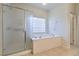Bathroom with soaking tub and glass shower at 4880 Da Vinci Way, Pahrump, NV 89061
