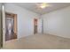 Bright bedroom with ceiling fan and adjacent hallway at 4880 Da Vinci Way, Pahrump, NV 89061